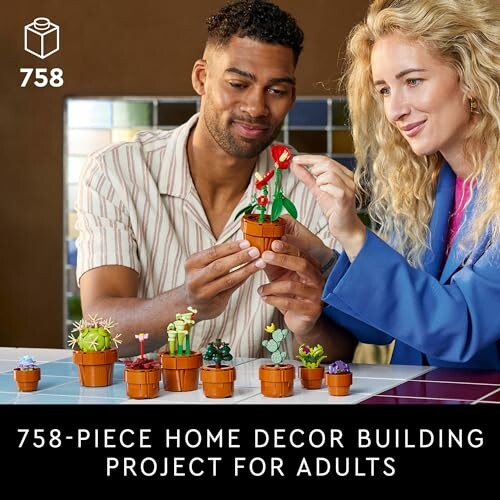 Two people assembling a 758-piece home decor building project with small plant models.