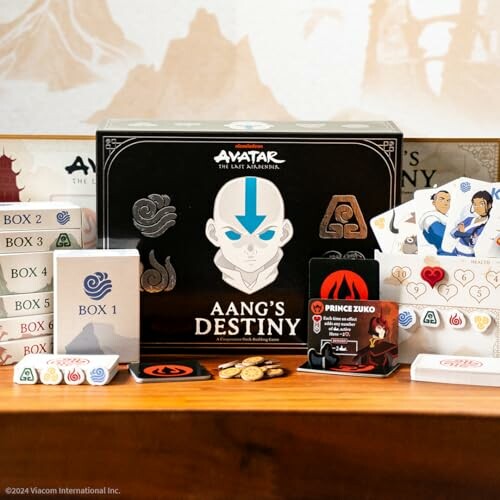 Aang's Destiny board game with components and cards displayed.