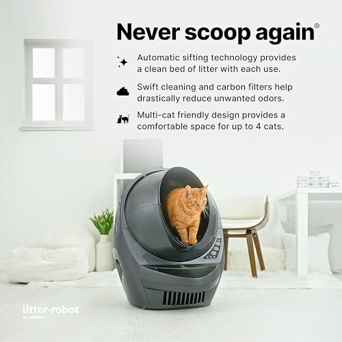 Automatic cat litter box with orange cat inside.