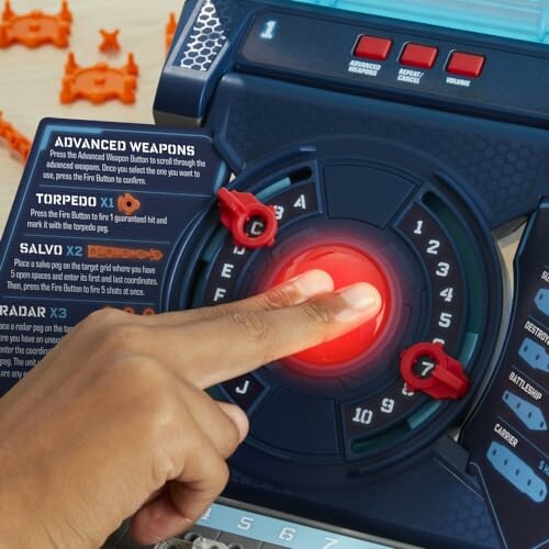 Person pressing button on a battleship game control panel.