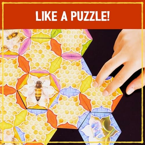 Hand assembling a colorful bee-themed puzzle with hexagonal pieces.