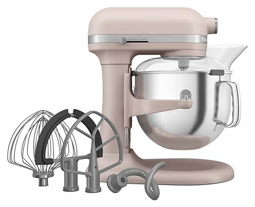 Beige stand mixer with various attachments and a metal mixing bowl.