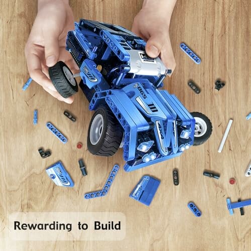 Hands assembling a blue LEGO car on a wooden surface.