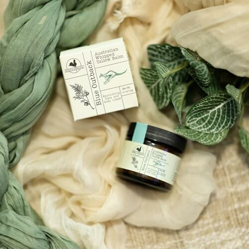 Blue Outback Australian Wildcrafted Pillow Balm with green scarf and leaves.