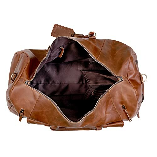 Open brown leather duffle bag with zipper