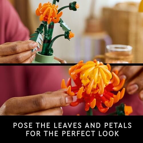 Hands assembling a colorful flower toy with orange and red petals.