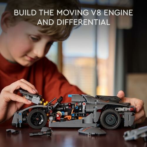 Child assembling a model car with V8 engine and differential.