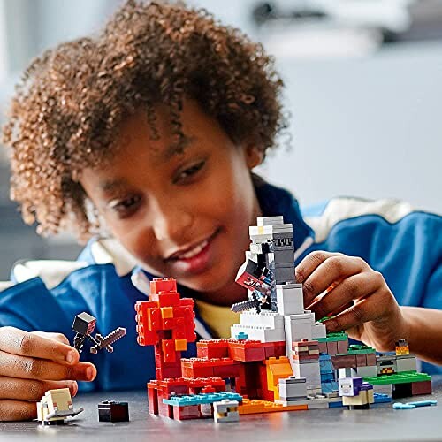 Child playing with a colorful LEGO set.