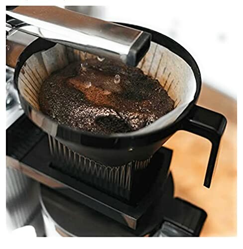 Close-up of coffee brewing in a filter