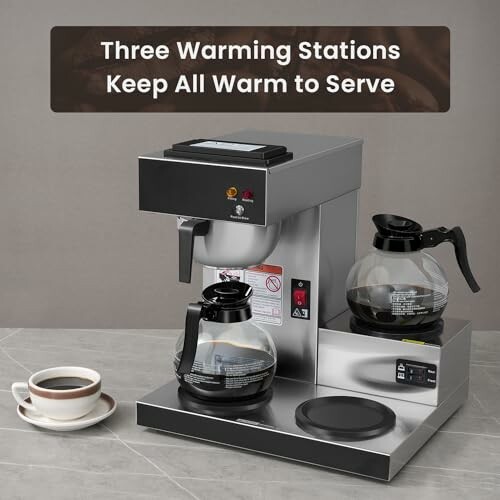 Coffee machine with three warming stations and two carafes