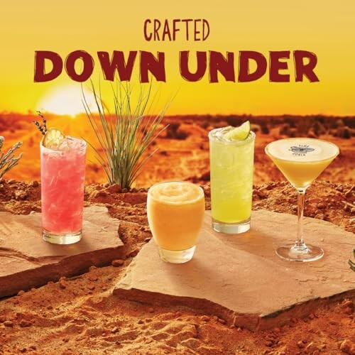 Four colorful cocktails on a desert landscape with sunset.