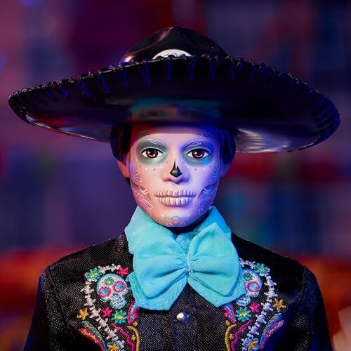 Doll dressed in Day of the Dead attire with painted face.