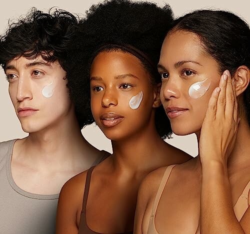 Three people with skincare cream on their cheeks.