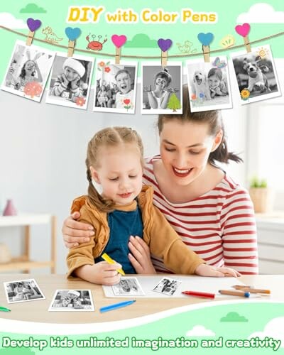 Mother and child coloring with hanging photos in background.