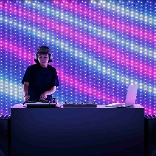 DJ performing with colorful LED background