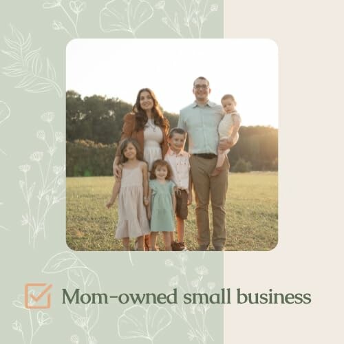 Family standing in a field at sunset