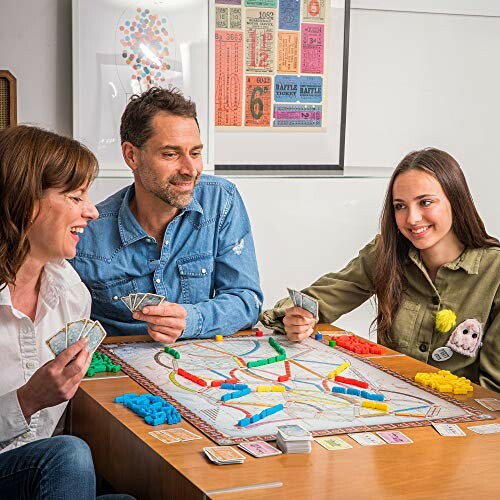 Family playing a board game at a table.