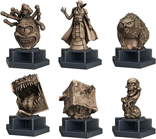 Collection of six fantasy monster figurines on stands.