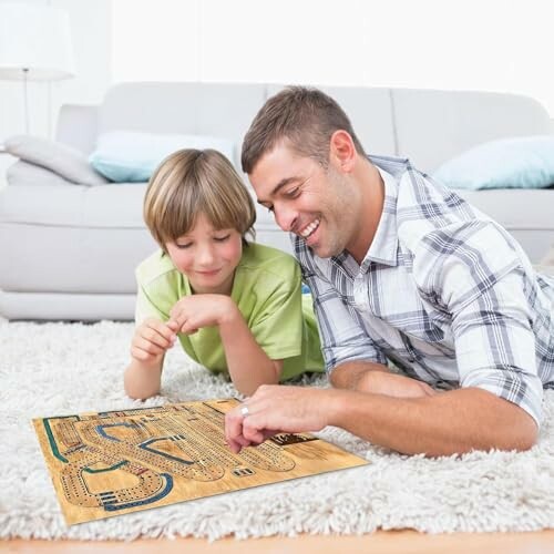 Father and son playing a board game on the floor.