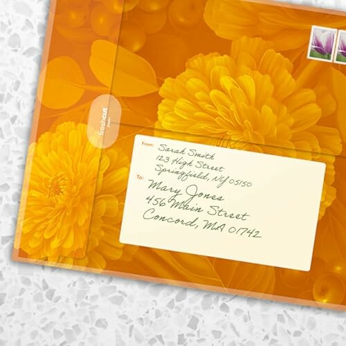 Floral envelope with handwritten address and stamps.