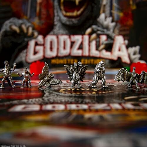 Miniature Godzilla game figures on board