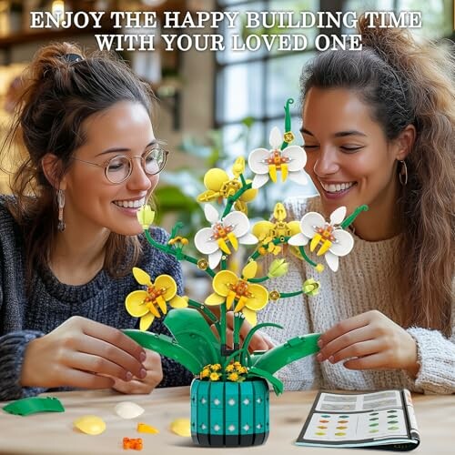 Two people assembling a LEGO flower set together.