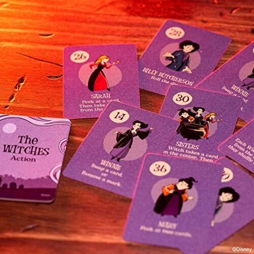 Hocus Pocus themed playing cards on a wooden table.