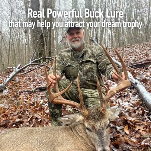 Hunter posing with a large buck in a forest setting.