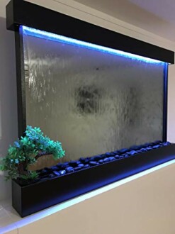 Indoor water wall with LED lighting and decorative plant