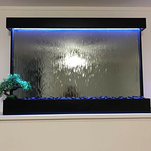 Indoor water wall fountain with blue lighting and a small decorative plant.