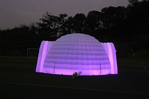 Glowing inflatable igloo tent at night