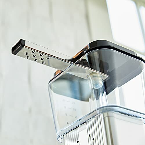 Close-up of a kitchen appliance with a grater attachment.