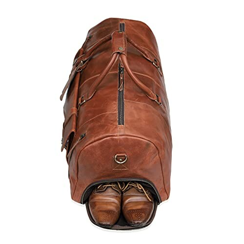 Brown leather duffel bag with shoe compartment.