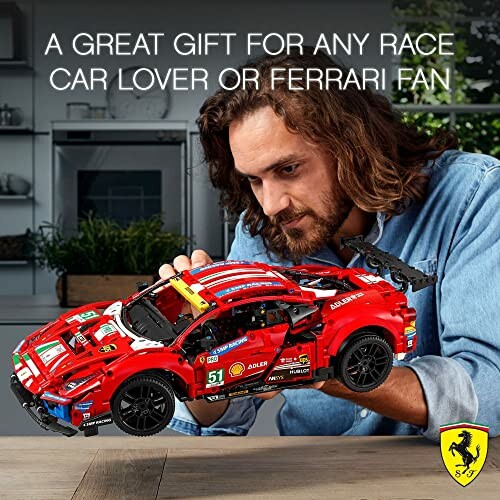 Person assembling a LEGO Ferrari race car model.