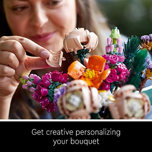 Person assembling a LEGO flower bouquet.