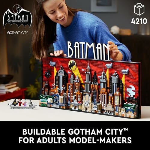 Person assembling a LEGO Gotham City model for adults.