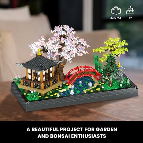 LEGO Japanese garden set with cherry blossom tree, bridge, and pond.