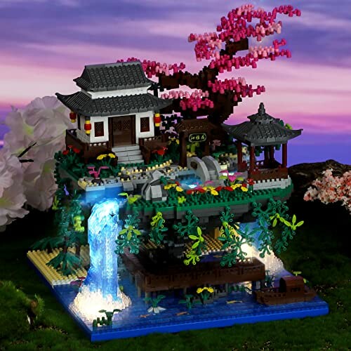 Lego Japanese garden with waterfall and cherry blossom tree.