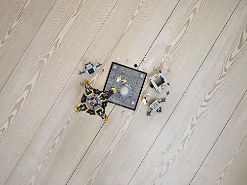 LEGO moon landing set on wooden floor