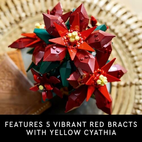 Lego poinsettia arrangement with red bracts and yellow centers.