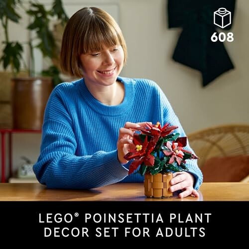 Woman assembling LEGO poinsettia plant set for adults.