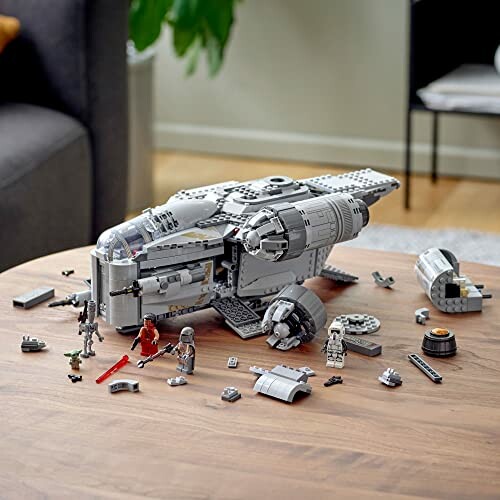 Lego spaceship set on a wooden table.