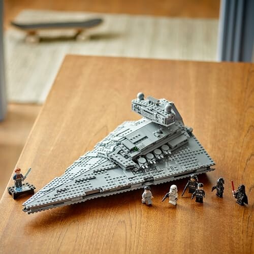 LEGO Star Destroyer with mini figures on a table.