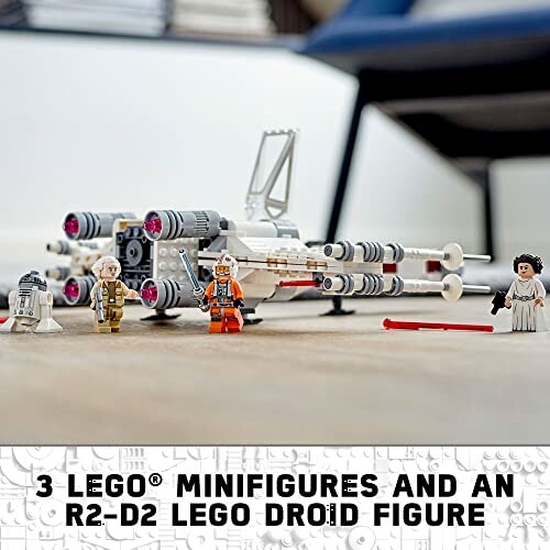 LEGO Star Wars set with minifigures and R2-D2 droid.