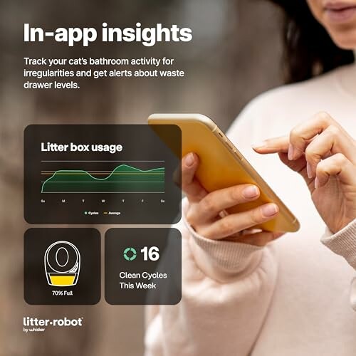 Person using phone app to track cat litter box activity with analytics.