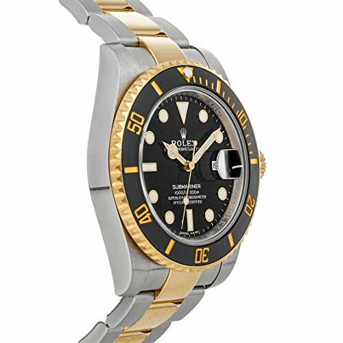 Luxury gold and silver dive watch with black bezel.