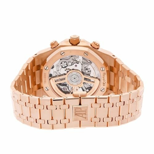 Rose gold luxury watch with visible mechanical movement.