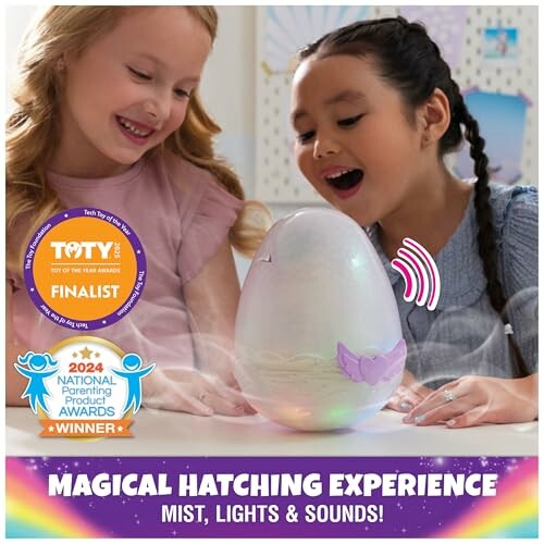 Two children excitedly watching a toy egg with mist, lights, and sounds.