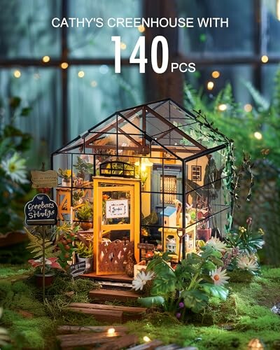 Miniature greenhouse kit with intricate details and greenery.