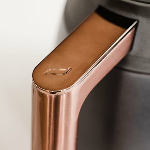 Close-up of a modern coffee maker handle